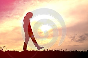 Silhouettes women playing at sunset