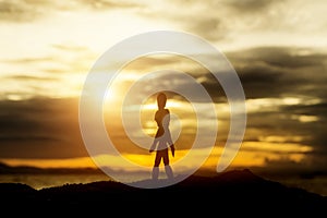 Silhouettes of wooden models feel lonely at sunset