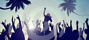 Silhouettes of Young People on a Beach Concert