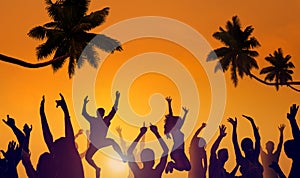 Silhouettes of Young People Partying on a Beach