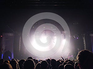 Silhouettes of young people before a scene at a concert. Rock group. Crowd of people at a concert