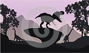 Silhouettte of baby Brachiosaurus and T-Rex photo