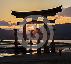 Silhoulette scene of Torii at Itsukushima Shrine photo