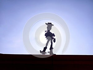 A silhoutte of a animated movie character- Woody from toy story