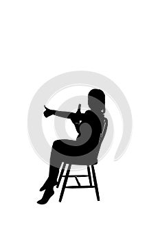 Silhoutte of a woman sitting on a chair