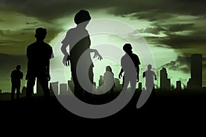 Silhoutte of zombies walking photo