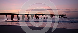 Silhoutted Ocean Pier at Sunrise