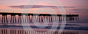 Silhoutted Ocean Pier at Sunrise