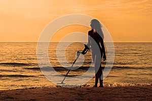 Silhuete girl with metal detector