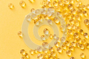 Silica gel granules over yellow background. Silicon moisture