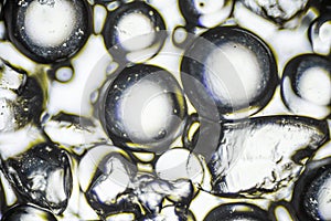 Silica gel for moisture control, absorbent particles under a light microscope