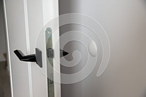 Silicon cover on the wall so that the door handle does not damage it