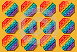 Silicon toys pattern. On a yellow background. Relaxation toy.