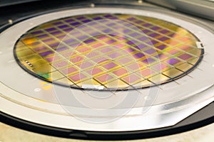 Silicon wafer with microchips fixed in the holder is on the chuck and ready for process cleaning photo