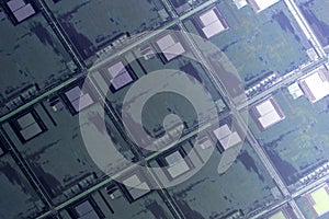 Silicon wafer with microchips used in electronics for the fabrication of integrated circuits. Full-frame high-tech macro