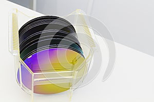 Silicon Wafers in plastic storage box in clear room of semiconductor foundry