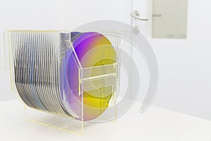 Silicon Wafers in plastic storage box in clear room of semiconductor foundry