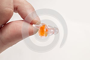 Silicone ear plugs for human ears on white background