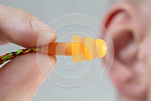 Silicone ear plugs for human ears on white background