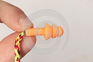 Silicone ear plugs for human ears on white background