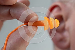 Silicone ear plugs for human ears on white background