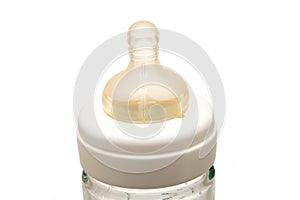 Silicone pacifier of a glass bottle for artificial feeding.