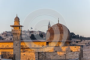 Siliver dome of Al-Aqsa Mosque under sunset in the evening, built on top of the Temple Mount, known as Haram esh-Sharif in Islam