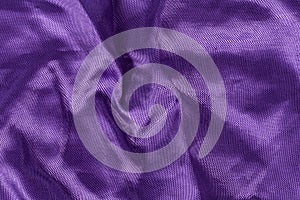 Silk background, texture of violet shiny fabric