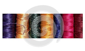 Silk and cotton threads for sewing and embroidery. Spools with multi-colored threads.