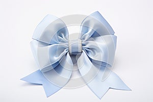 Silk gift bow on white background, elegant present mood, space for personalization