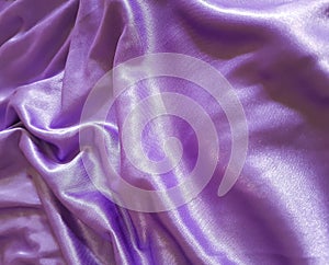 Silk purple fabric background drapery, satiny textile, decor curve, wave, material