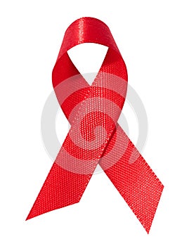 A silk red ribbon in the form of a bow is isolated on a white background, a symbol of the fight against AIDS and a sign of