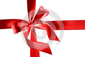 Silk red ribbon for gift, isolated on white, with tied bow