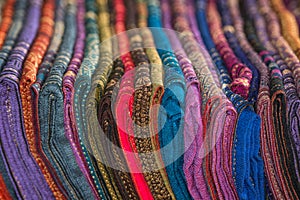 Silk shawls in different colors for sale.