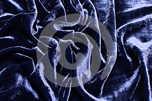Silk and viscose velvet fabric. The color is blue. Texture, background, pattern.