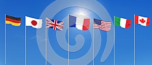 Silk waving G7 flags of countries of Group of Seven Canada, Germany, Italy, France, Japan, USA states, United Kingdom. Blue sky