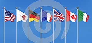 Silk waving G7 flags of countries of Group of Seven Canada, Germany, Italy, France, Japan, USA states, United Kingdom. Blue sky