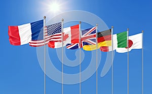 Silk waving G7 flags of countries of Group of Seven Canada, Germany, Italy, France, Japan, USA states, United Kingdom. Blue sky