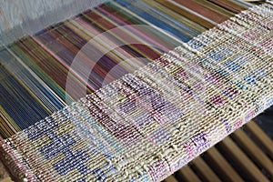 Silk weaving on a loom photo