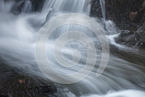 Silky, turbulent water of a small waterfall in Hebron, Connecticut