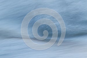 Silky water surface detail from rapid mountain stream in long exposure