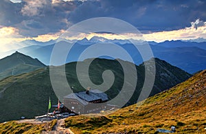 Sillian hut in Carnic Alps main ridge and Hohe Tauern at sunset