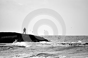 Sillouette of a man, water front, Achziv, Israel