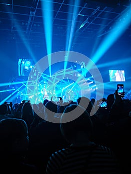 Sillouettes of spectators on a concert photo