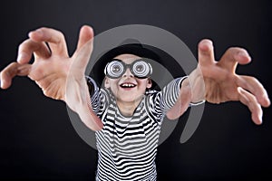 Silly little boy in black hat