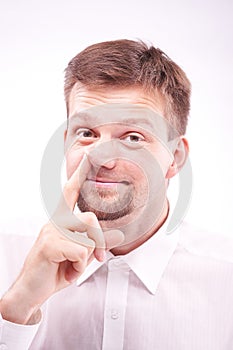 Silly man picking his nose