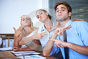 Silly portrait, pose and business people with hand gesture for cool office environment, goofy workforce or picture