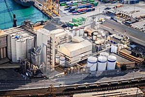 The silo Elevator in the cargo sea port with a railway