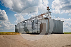 silos on agro-industrial complex with seed cleaning and drying line for grain storage. Granary elevator