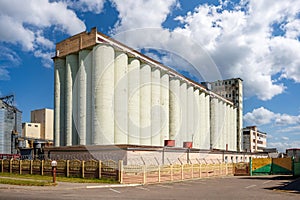 silos on agro-industrial complex with seed cleaning and drying line for grain storage. Granary elevator photo